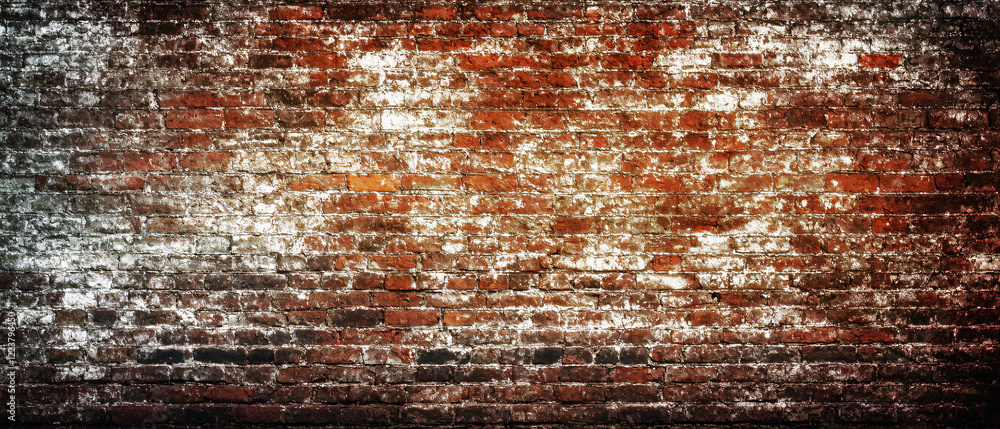 Obraz premium Old brick wall. Texture of a red brick wall with crumbling plaster. Brick grunge background.