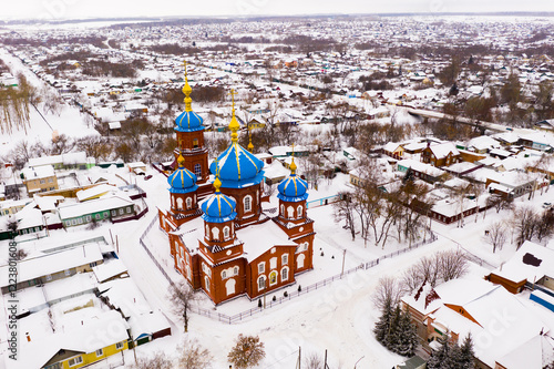 Aerial view of Church of the Intercession and residental quarters in winter in the city Petrovsk, Russia. photo