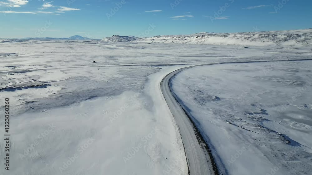 View of Winter snow storm blowing on road / Iceland