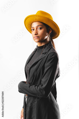 Принти на полотні Photo of brunette woman wearing a trench coat and yellow hat