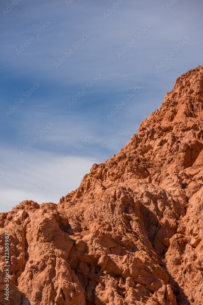 Fototapeta premium Rocky desert formations colorful red mountain with a blue sky 
