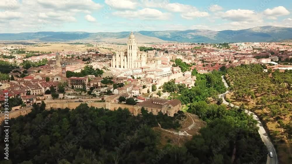 Aerial view capturing Segovia, Spain, with the stunning Cathedral and charming cityscape nestled among rolling hills, reflecting the essence of this historic locale, drone establishing shot Aerial view capturing Segovia, Spain, with the stunning Cathedral and charming cityscape nestled among rolling hills, reflecting the essence of this historic locale, drone establishing shot