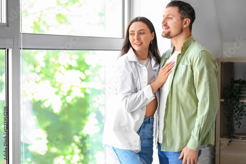 Happy young couple at home