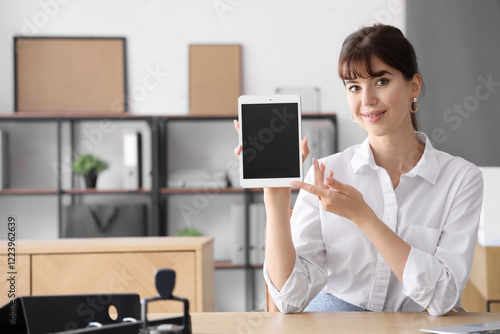 Young businesswoman holding...