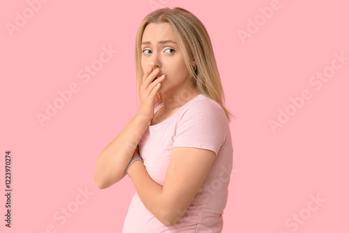 Embarrassed pregnant woman ...