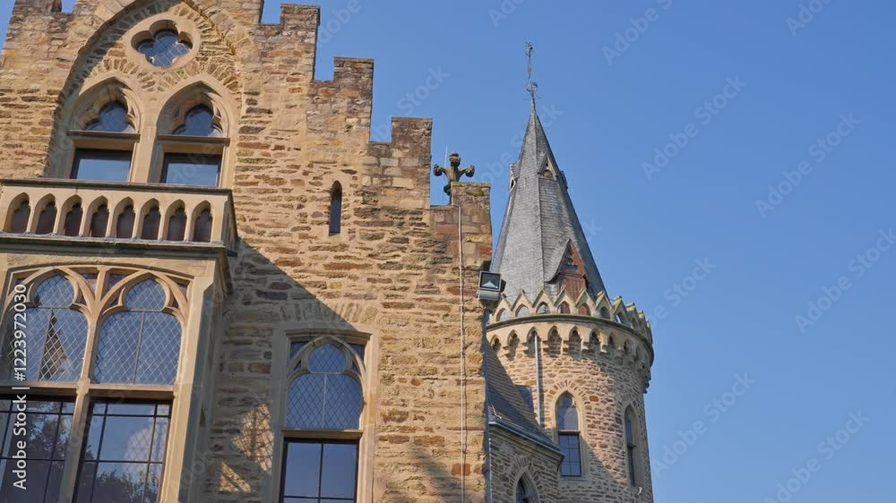 Closeup exterior detail of an elegant medieval castle and tower on a cloudless day with parallax tracking movement, Germany Closeup exterior detail of an elegant medieval castle and tower on a cloudless day with parallax tracking movement, Germany