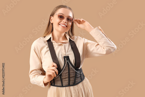 Stylish young woman in sung...