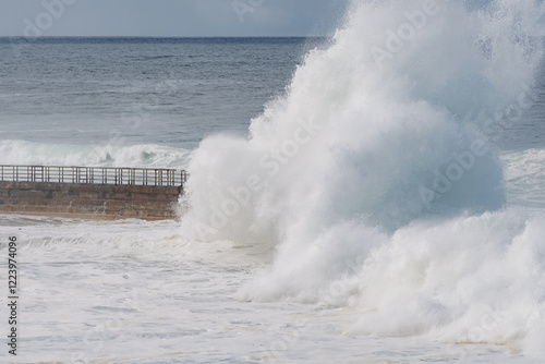 king tide waves crashing on the beach