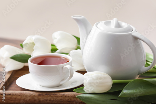 White ceramic teapot and te...