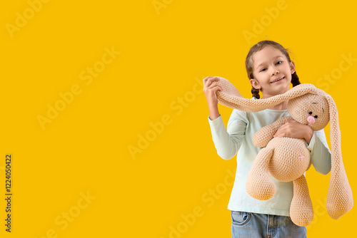 Cute little girl with knitt...
