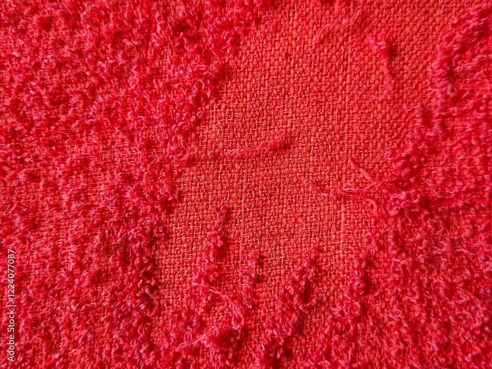 Red towel texture for background. The fabric or textile consists of cotton fiber. Looks luxurious, soft, dry, soft and clean. For background on babies, spas, hotels, laundry and hygiene Red towel texture for background. The fabric or textile consists of cotton fiber. Looks luxurious, soft, dry, soft and clean. For background on babies, spas, hotels, laundry and hygiene