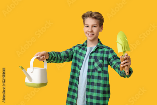 Teenage boy with gardening ...