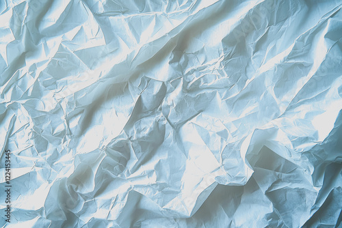 Wallpaper Mural Crumpled white paper sheet on a blue background creating a textured abstract image for design or artistic purposes Torontodigital.ca