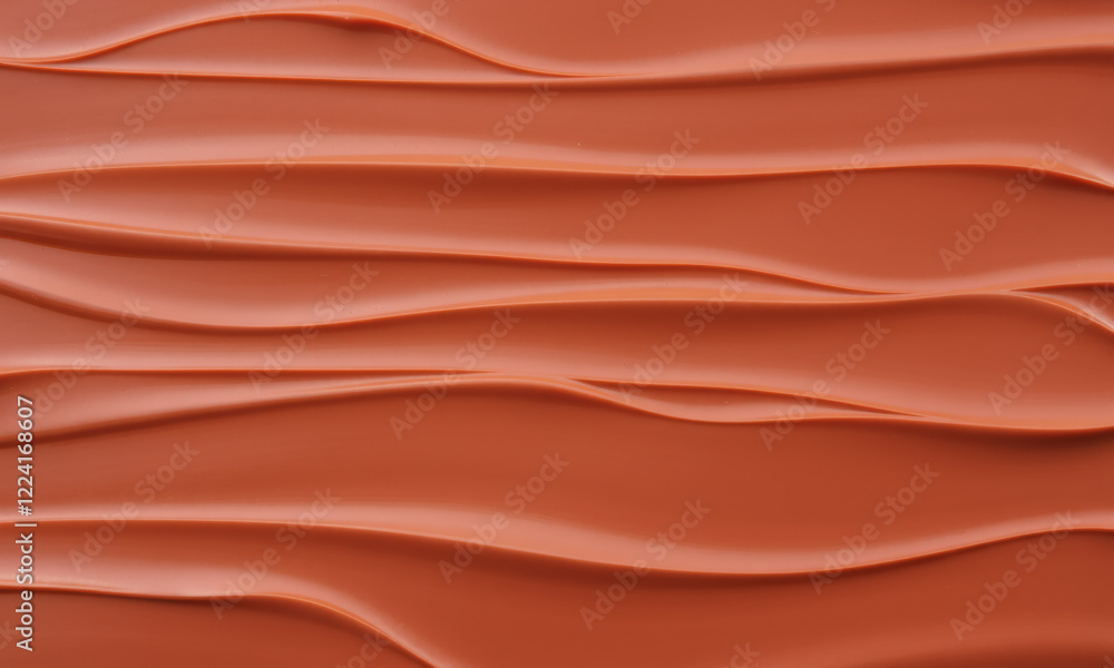 Fototapeta premium Smooth chocolate surface with flowing waves, rich texture, and warm color. Perfect for dessert backgrounds or culinary themes