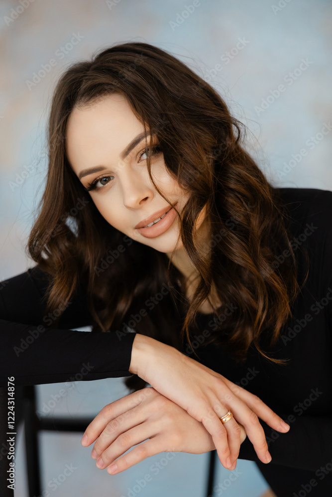 Young Woman Relaxing with Confident Expression Young Woman Relaxing with Confident Expression