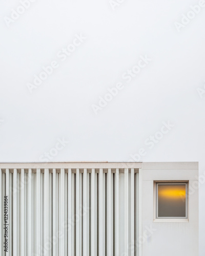 Wallpaper Mural Modern architectural design featuring vertical slats and illuminated window in cloudy sky Torontodigital.ca