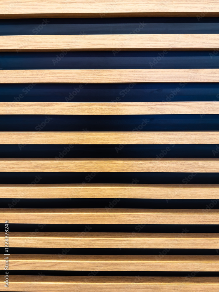 Fototapeta premium Interior wall oak slats on a black background are a little different. Side views of the lamellar wall.