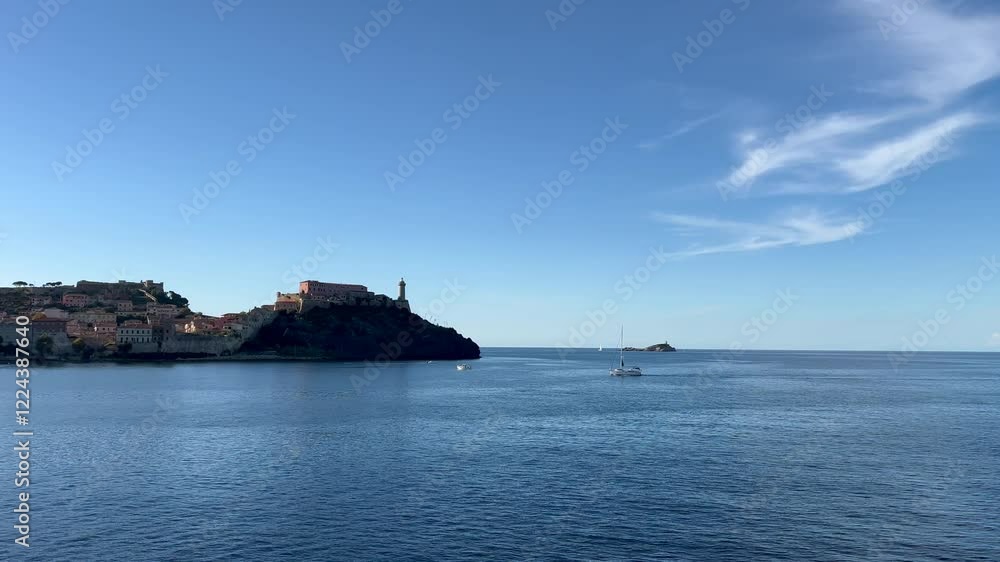 View of the coastal town of Portoferraio on the island of Elba in Tuscany, Italy, on a sunny day View of the coastal town of Portoferraio on the island of Elba in Tuscany, Italy, on a sunny day