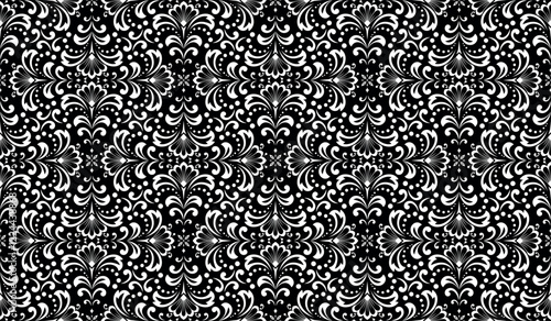 Wallpaper in the style of Baroque. White and black floral ornament. Seamless vector background. Graphic pattern for fabric, wallpaper, packaging. Ornate Damask flower illustration.