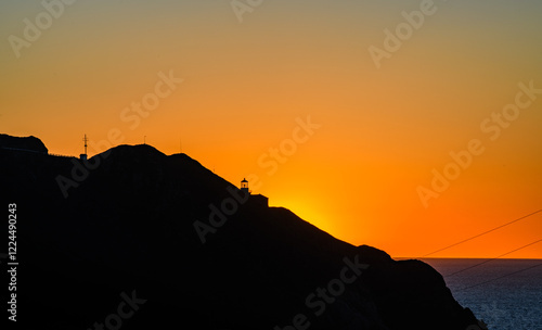 Point Sur lighthouse at Dusk. Yellow, orange sky. photo