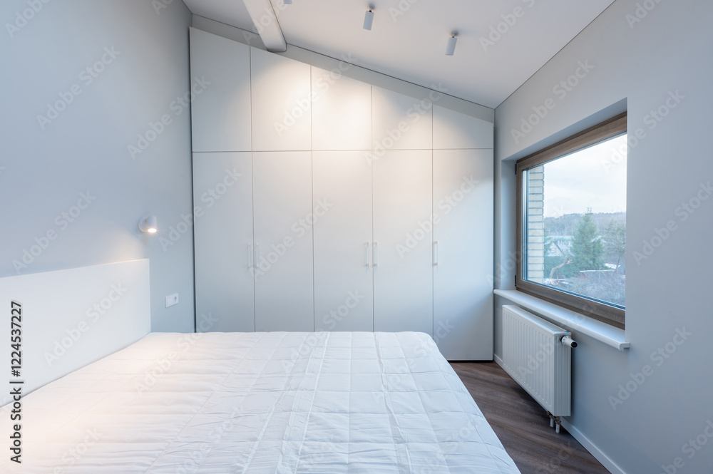 Obraz premium Modern Minimalist Luxury Home Bedroom Interior with White Wardrobe and Natural Light