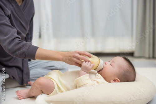 Baby relaxing while drinking warm milk