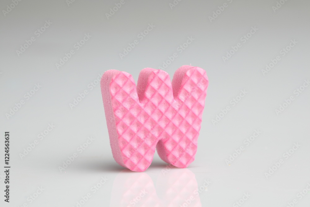 W in colorful foam on a white background W in colorful foam on a white background