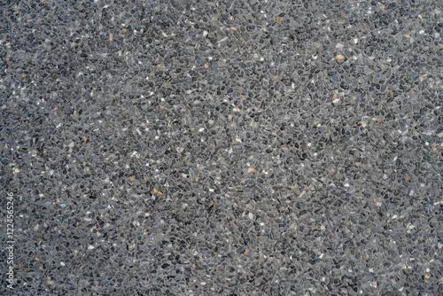 Black gravel stone terrazzo wall background.