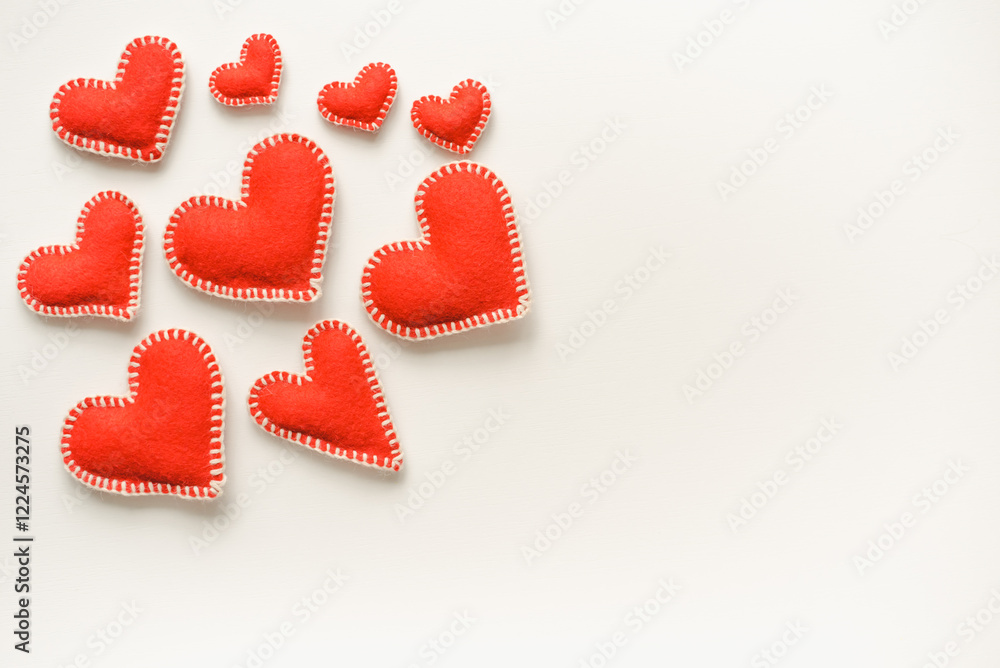 Red hearts on white background. Isolated hearts on white background. Valentine's Day background. Red felt hearts. Red hearts on white background. Isolated hearts on white background. Valentine's Day background. Red felt hearts.
