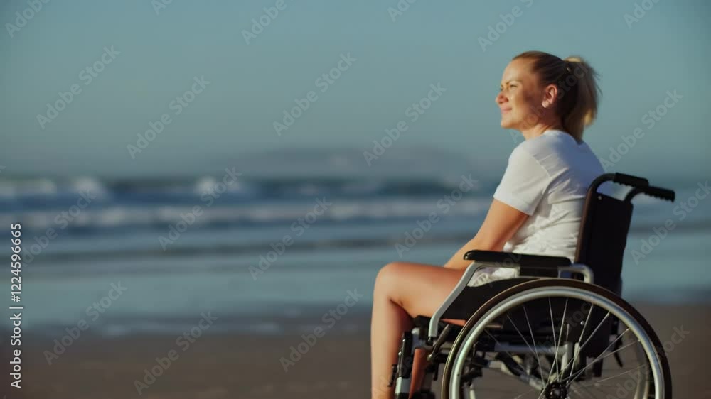 Young disabled woman enjoying sunny day at beach Young disabled woman enjoying sunny day at beach