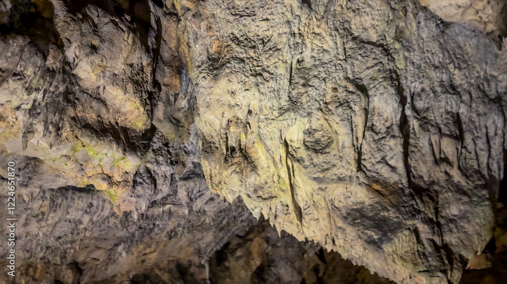 Rugged cave interior showcasing natural rock formations, ideal for concepts of exploration, geology, and adventure tourism Rugged cave interior showcasing natural rock formations, ideal for concepts of exploration, geology, and adventure tourism