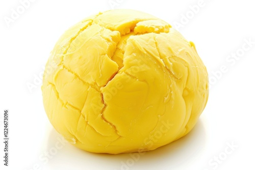 A vibrant yellow ball of dough cracks open, revealing rich texture and color in a bright, inviting kitchen setting isolated on transparent background photo