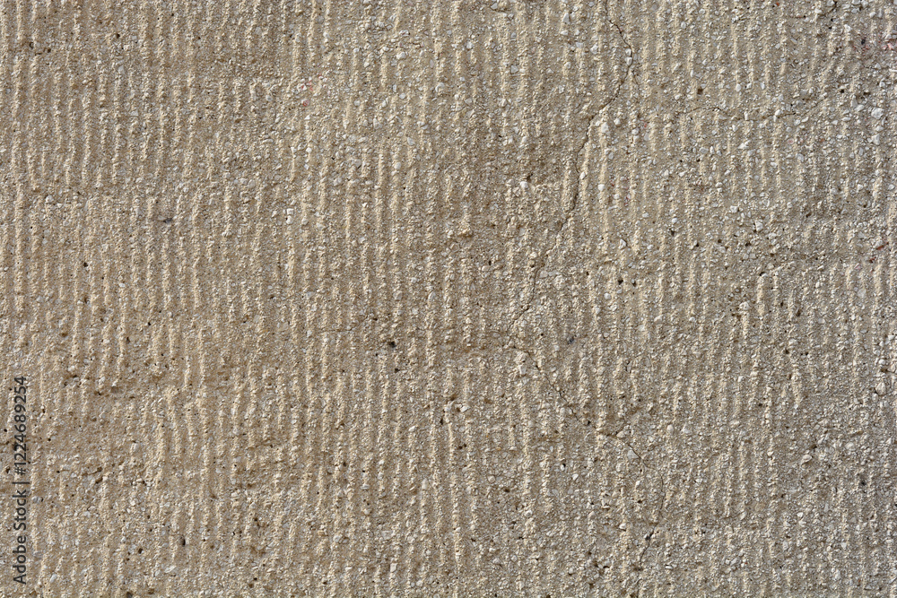 A detail of a facade with parallel grooves with a crack A detail of a facade with parallel grooves with a crack