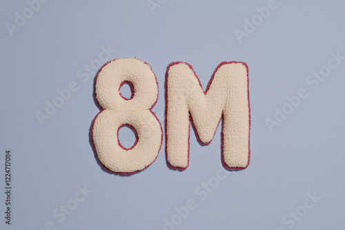 Eight Million:  Cream-colored, plush textile numbers 