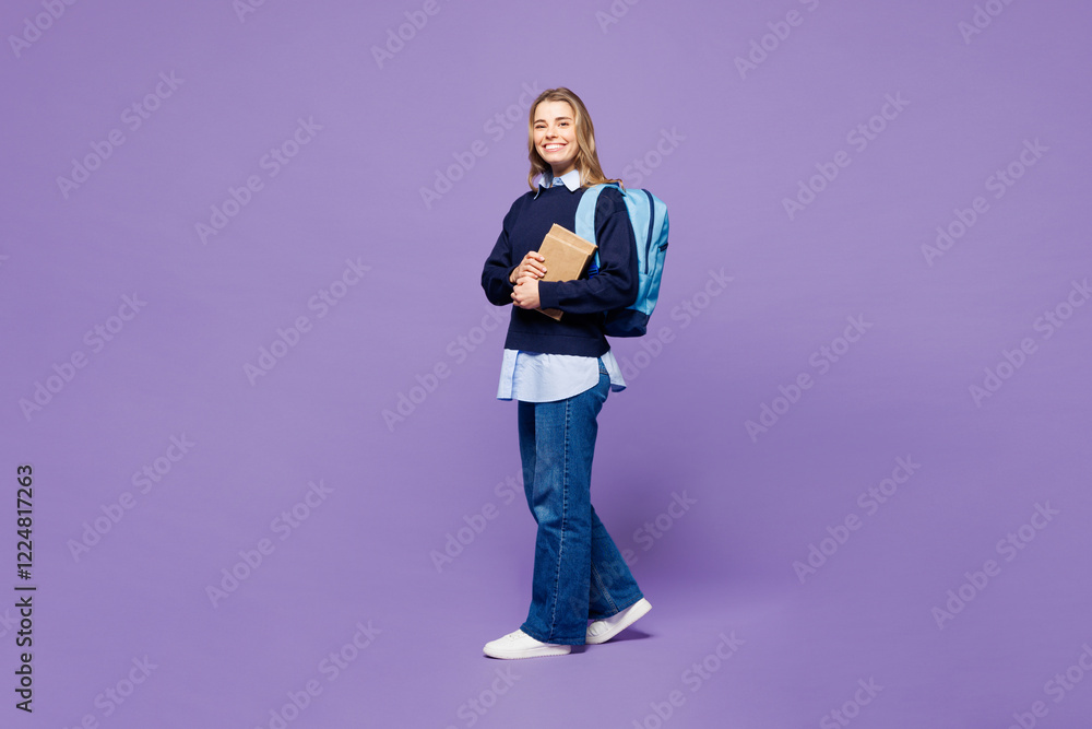 Full body young smart girl student wear blue casual clothes glasses backpack bag hold books walking going look camera isolated on plain light purple background. High school university college concept. Full body young smart girl student wear blue casual clothes glasses backpack bag hold books walking going look camera isolated on plain light purple background. High school university college concept.