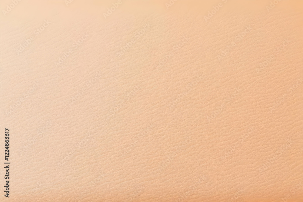 Close-Up of Peach Colored Leather Texture Shows Subtle Grain and Soft Lighting Effect Close-Up of Peach Colored Leather Texture Shows Subtle Grain and Soft Lighting Effect