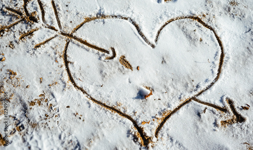 Drawn heart on snow, outline