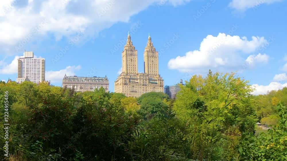 Central Park under a blue sky with clouds. Manhattan, New York City, USA Central Park under a blue sky with clouds. Manhattan, New York City, USA