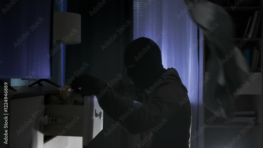 robbery, adult male in balaclava of dubious reputation rummaging through things late at night robbery, adult male in balaclava of dubious reputation rummaging through things late at night