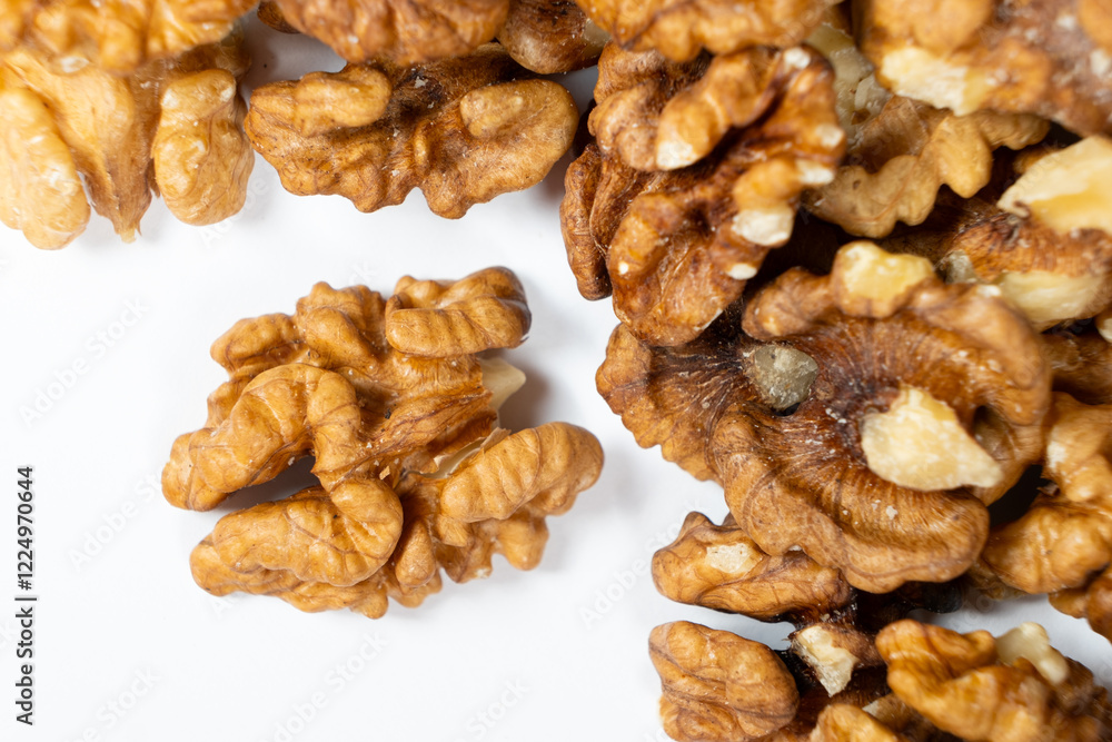 Shelled walnuts on a white background close-up Shelled walnuts on a white background close-up