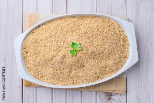 Farofa, typical brazilian manioc flour side dish over wooden table