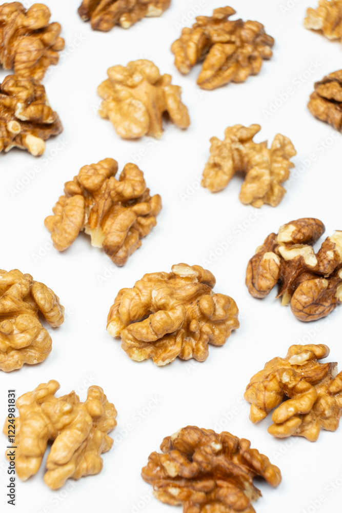 Shelled walnuts on a white background close-up Shelled walnuts on a white background close-up