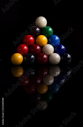 billiard balls in a triangular arrangement against a black background.
