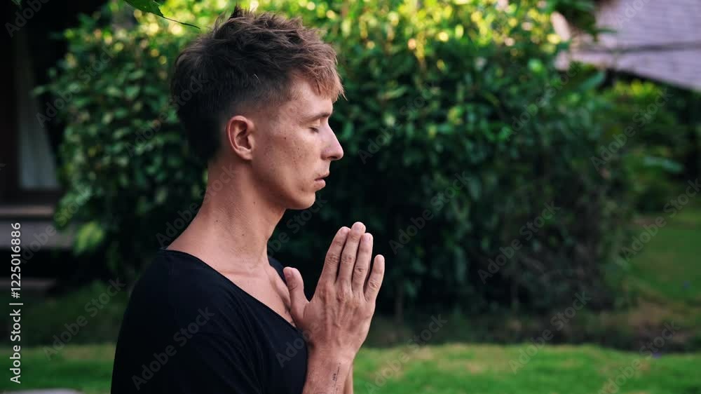 Yoga Meditation and Breathing of Handsome Man Enjoying Tranquility of Green Park. Mental Health and Mind Freedom of One Modern Yogi Inhaling Slow and Praying. Close Up Face of Guy Gesturing Namaste Yoga Meditation and Breathing of Handsome Man Enjoying Tranquility of Green Park. Mental Health and Mind Freedom of One Modern Yogi Inhaling Slow and Praying. Close Up Face of Guy Gesturing Namaste