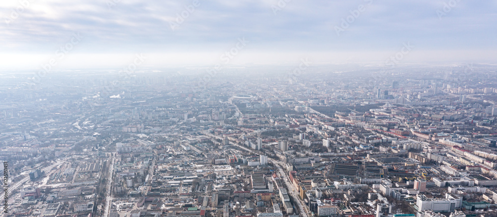 Fototapeta premium city panorama from the height of the drone flight. residential area in the winter. aerial overhead view.