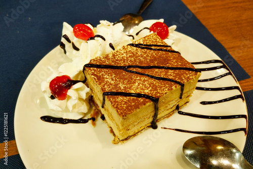 Fotografie Decadent Tiramisu Dessert with Whipped Cream and Cherries for Gourmet Dining