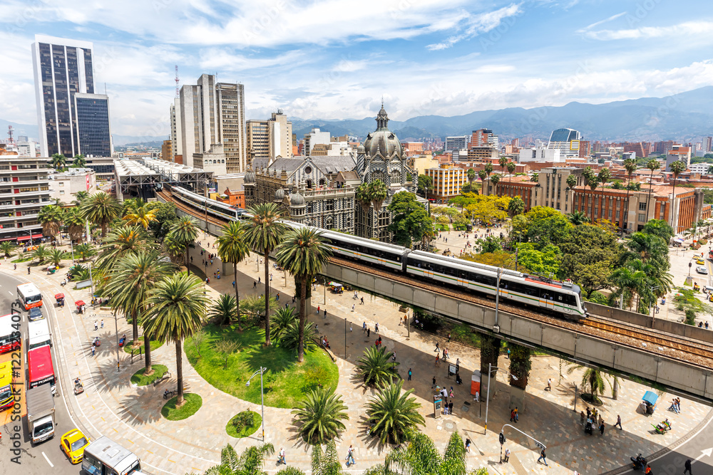 custom made wallpaper toronto digitalMedellin skyline with Metro de MedellÃn train at Plaza Botero in Medellin, Colombia
