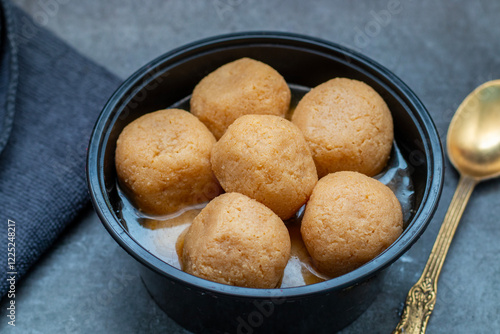 Delightful Nolen Gurer Rosogolla, A Sweet Bengali Tradition with Rich Flavors and Unique Date Palm Jaggery Essence photo