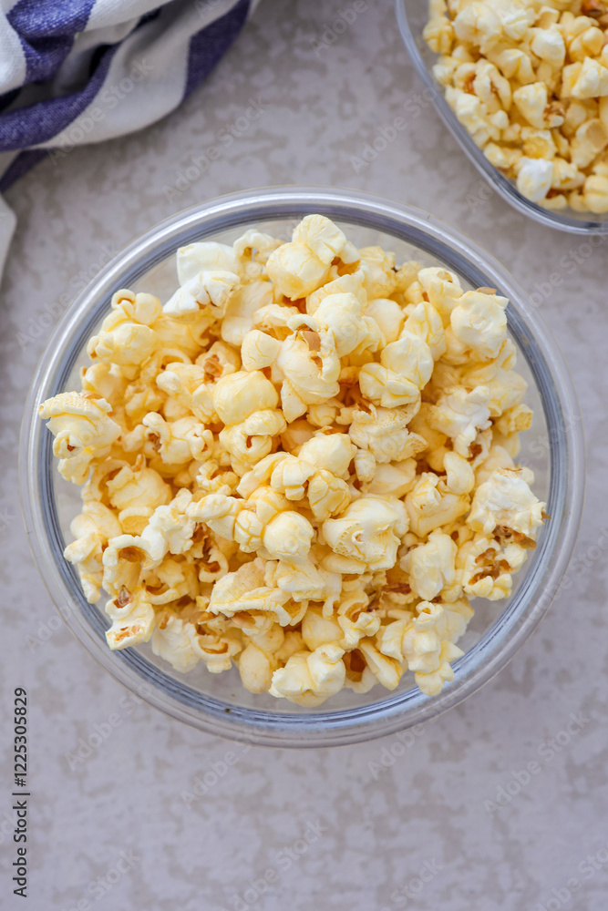 Popcorn in a clear bowl , top view Popcorn in a clear bowl , top view