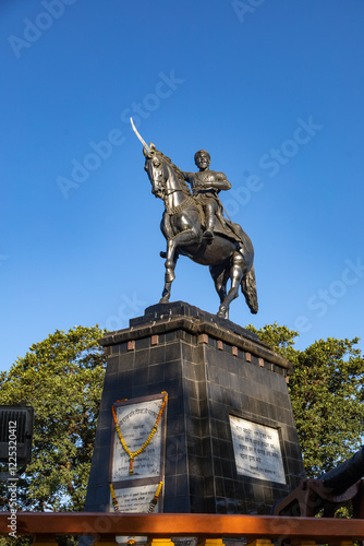 Statue of Chhatrapati Shivaji Maharaj on horseback riding a horse with raised sword Pratapgad, Maharashtra, India